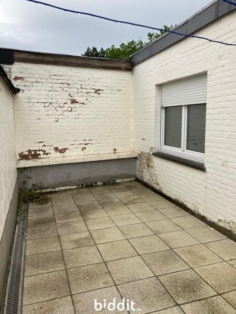 photo 11 du bien Immeuble avec caves,garage,appartement,combles aménageables 